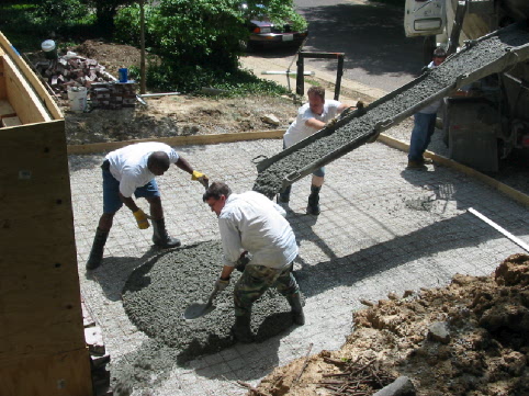 Ben, Randy and George direct the concrete for the driveway